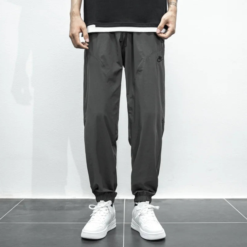 Nike Breathable Trousers Men and Women Nylon Embroidered Quick Drying Waterproof Popular Sweatpants Grey