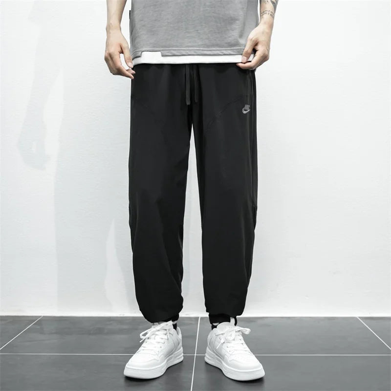 Nike Breathable Trousers Men and Women Nylon Embroidered Quick Drying Waterproof Popular Sweatpants Grey