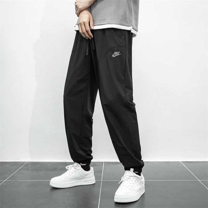 Nike Breathable Trousers Men and Women  Nylon  Embroidered  Quick Drying  Waterproof  Popular Sweatpants Grey