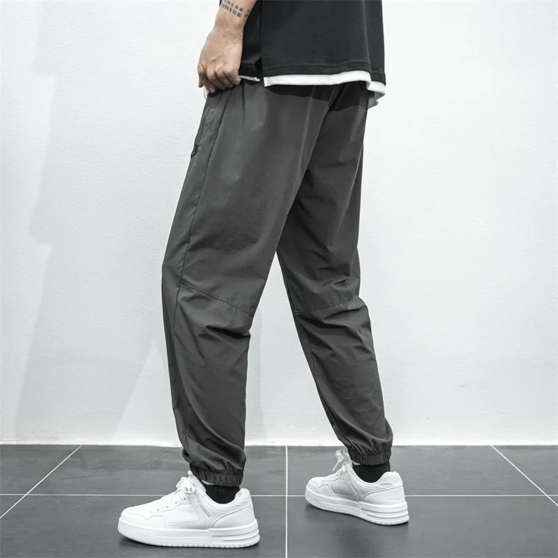 Nike Breathable Trousers Men and Women  Nylon  Embroidered  Quick Drying  Waterproof  Popular Sweatpants Grey